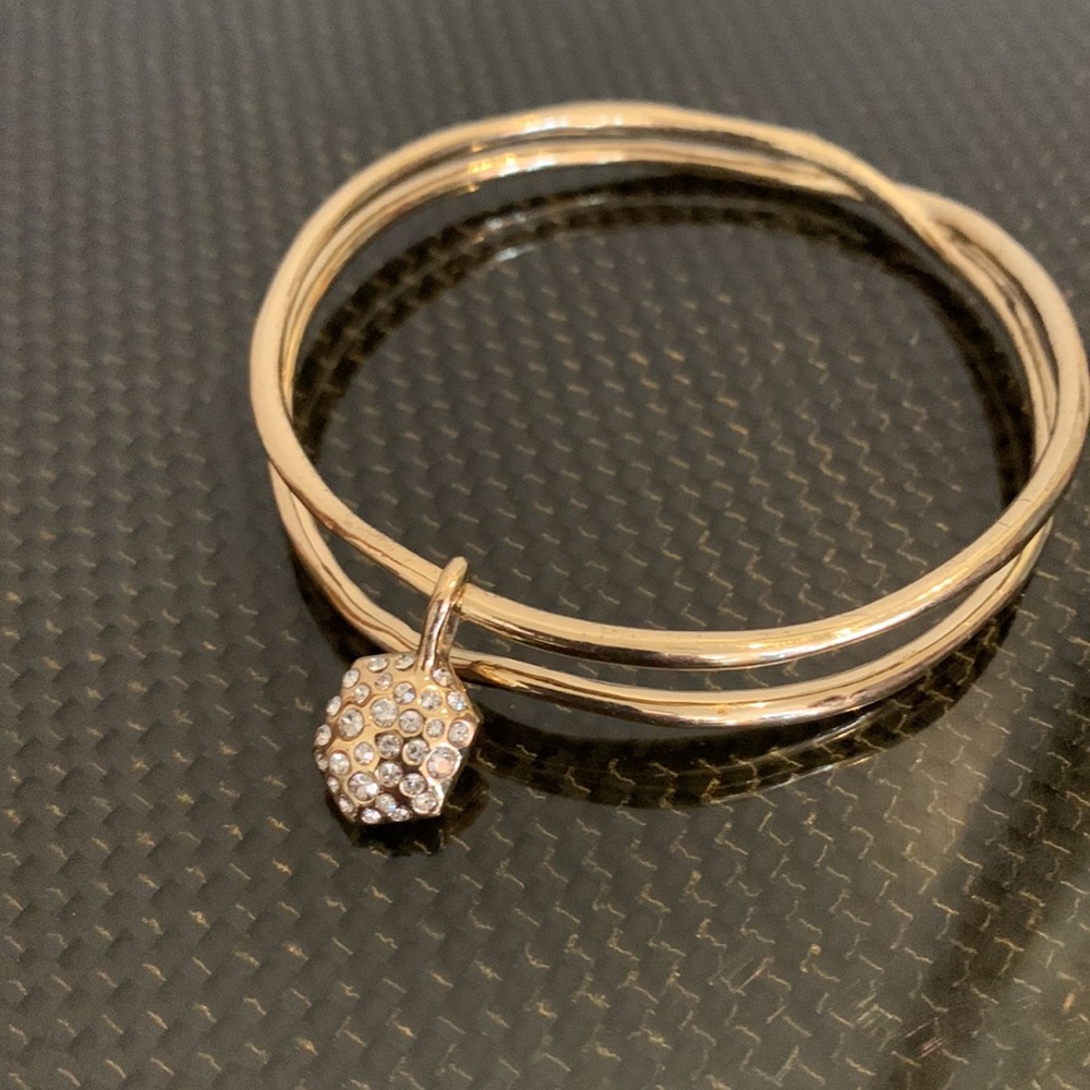 Alexis Bittar gold bracelet with crystal and stone heart